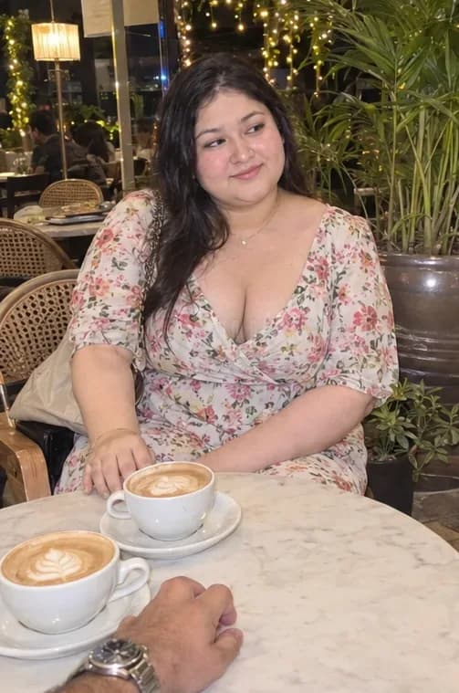 Dating girl in a floral dress on a coffee date at a Bandra cafe